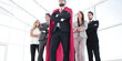 © ASDF - leader in the red cloak and the business team standing together