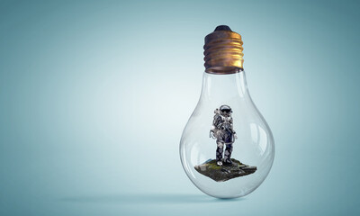Wall Mural - spaceman inside light bulb . mixed media