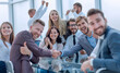 © ASDF - happy business people shaking hands in the conference room