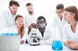 © ASDF - Group of young scientists working in the chemical laboratory