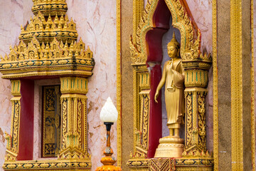 Wall Mural - Phuket, Thailand - May, 07, 2022 : Buddhist statues of Wat Chalong in Phuket, Thailand