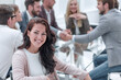 © ASDF - smiling business woman sitting in front of the table in the meeting room