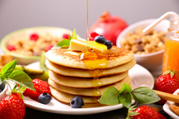 Wall Mural - stack of pancakes with syrup and fruits