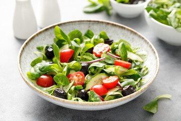 Wall Mural - Salad with corn salad, cucumber, olives and tomato