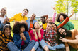 Multiracial friends taking selfie outdoors - Portrait of happy young people making funny faces together - Teenagers having fun outside in summer day - Friendship and youth concept