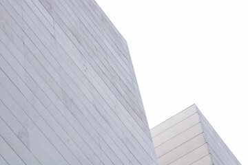 Poster - Abstract contemporary office building. Modern white building facade close up on clear day.
