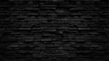 Old Black Stone Brick Wall Texture For Background Or Tiles Floor Decorative Design.