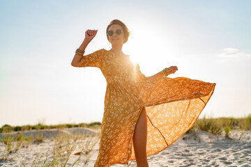 stylish attractive slim smiling woman on beach in summer style fashion trend outfit