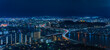 © kuremo - Bird's eye view of a night panorama cityscape of Fukuoka with the illuminated urban expressway circular route crossing in zig-zag the Muromi river taken from the observation deck of Fukuoka Tower.