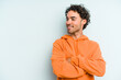 © Asier - Young caucasian man isolated on blue background smiling confident with crossed arms.