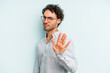 © Asier - Young caucasian man isolated on blue background rejecting someone showing a gesture of disgust.