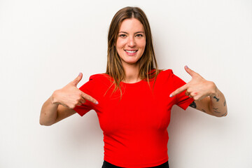 Young caucasian pregnant woman isolated on white background points down with fingers, positive feeling.