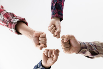 Wall Mural - young business people putting their hands together