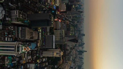 Wall Mural - day to night vertical time lapse of Bangkok city downtown and road traffic in Thailand , Cityscape