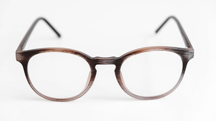 Round optical glasses on a white background