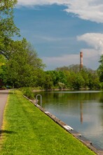 Vertical Shot Of Erie Canal Fairport Surrounded By Green Trees In New York