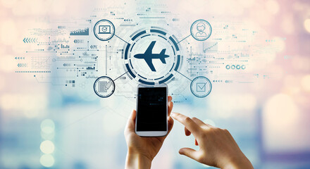 Wall Mural - Flight ticket booking concept with hand pressing a smartphone screen