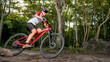 © VStudio - Mountain bikers ride MTB, mountain bike downhill to the extreme. Asian man rides MTB, mountain bike downhill in the wild to extremes. Extreme Sport and MTB, mountain bike downhill Concept.