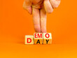 © Dzmitry - Demo day symbol. Concept words Demo day on wooden cubes. Businessman hand. Beautiful orange table orange background. Business and demo day concept. Copy space.