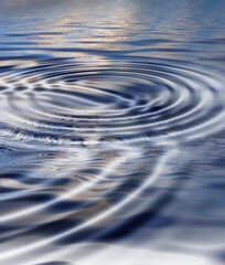 Zoom in on a ripple effect and pattern on a water surface. Creative puddle with abstract circle rings, calm, peaceful and tranquil meditative theme with copyspace. Cool nature wallpaper or background