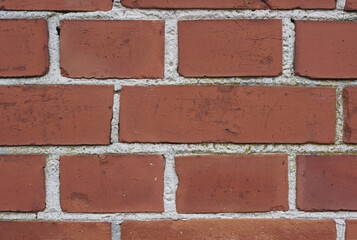 Closeup of a red brick wall of a house or home. Background of clean, modern, rustic, building and masonry. Historic housing design for detail and concept of an urban structure outside with copyspace