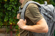 Military tactical backpack.Military backpack.Tactical hiking backpack on a military man. Place for text. Copy space. Military concept. No war.