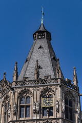 Wall Mural - Architectural details of medieval Cologne Town Hall (Rathaus Koln) - XV century Gothic style tower. Cologne, North Rhine Westphalia, Germany.