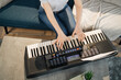 © sofiko14 - Close up of hand of caucasian girl playing piano. Pretty women in music therapy by playing piano on music room. Young female girl in piano lesson. Relaxing at home. Music concept.