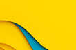 © vejaa - Abstract multicolored papers geometry flat lay composition background. Waved shaped blue, yellow color lines background. Top view, copy space