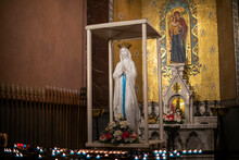 Candles In Front Of Virgin Mary Altar At The Sanctuary Of Our Lady Of Lourdes