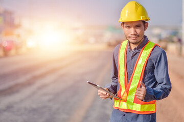 Wall Mural - Asian man construction safety suit helmet onsite work, Asian man Engineer