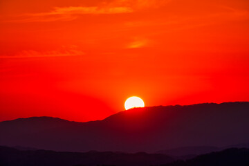 Scenic view of mountains against sky during sunrise