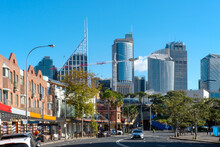 Sydney City Skyline From Woolloomooloo With Road And Shops In Foreground