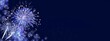 Fireworks, white-blue sylvester-fireworks on dark blue background with sparks and space for text