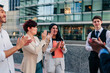 © bernardbodo - Business people applauding outdoors