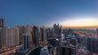 © HyperlapsePro - Panorama of various skyscrapers in tallest recidential block in Dubai Marina aerial night to day timelapse