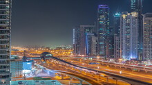 Dubai Marina Skyscrapers And Sheikh Zayed Road With Metro Railway Aerial Night Timelapse, United Arab Emirates