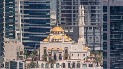 Wall Mural - Dubai Marina skyline with Mohammad Bin Ahmed Al Mulla mosque aerial timelapse