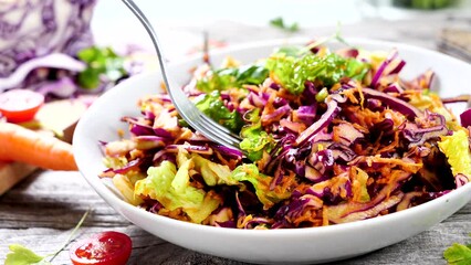 Wall Mural - mixed vegetable salad with cabbage, carrot and lettuce