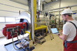 Mechanics repair and control a machine in a modern industrial plant