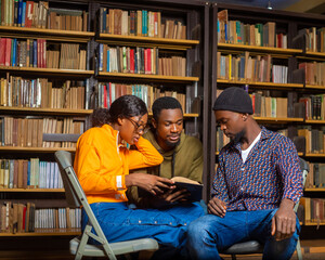 Wall Mural - happy young university students studying with books in library.