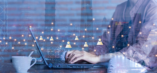 businessman work with laptop and partners network icon at workplace,business partners marketing conc