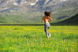 © Antonioguillem - Back view portrait of a runner running in a field in the mountain