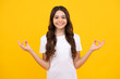 © Olena - Happy teenager, positive and smiling emotions of teen girl. Teenager child in white shirt hold hands in yoga om aum gesture relax meditate try calm, isolated on yellow background.