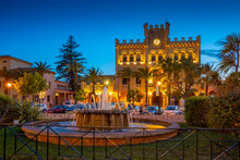 View Of Fountain And Town Hall In Placa Des Born At Dusk, Ciutadella, Menorca, Balearic Islands