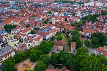 aerial view of the historic center of erfurt old city from above with old houses , bridge and church