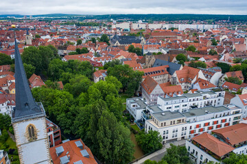 aerial view of the historic center of erfurt old city from above with old houses , bridge and church
