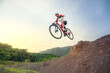 © VStudio - Mountain bikers ride MTB, mountain bike downhill to the extreme. Asian man rides MTB, mountain bike downhill in the wild to extremes. Extreme Sport and MTB, mountain bike downhill Concept.