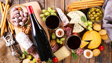 Bottle Of Red Wine And Cheese Platter