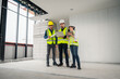 © VStudio - Engineer, architect and construction supervisor Use tablet to record information while inspecting construction work. Construction supervisor, architect or engineer inspect construction inside building